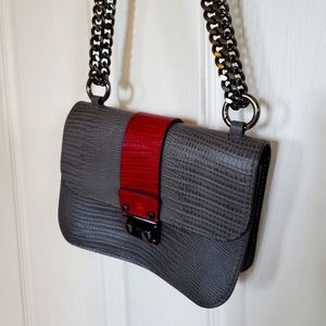 Grey purse with a double chain shoulder strap